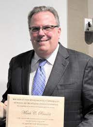 Mr. Mark C. Roualet