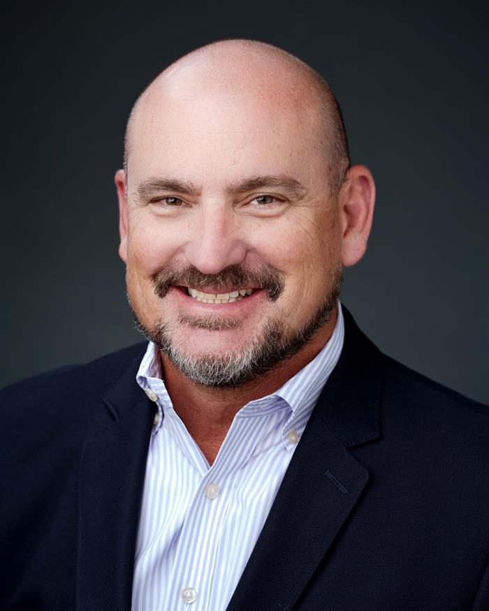 Mr. Mark E. Patten